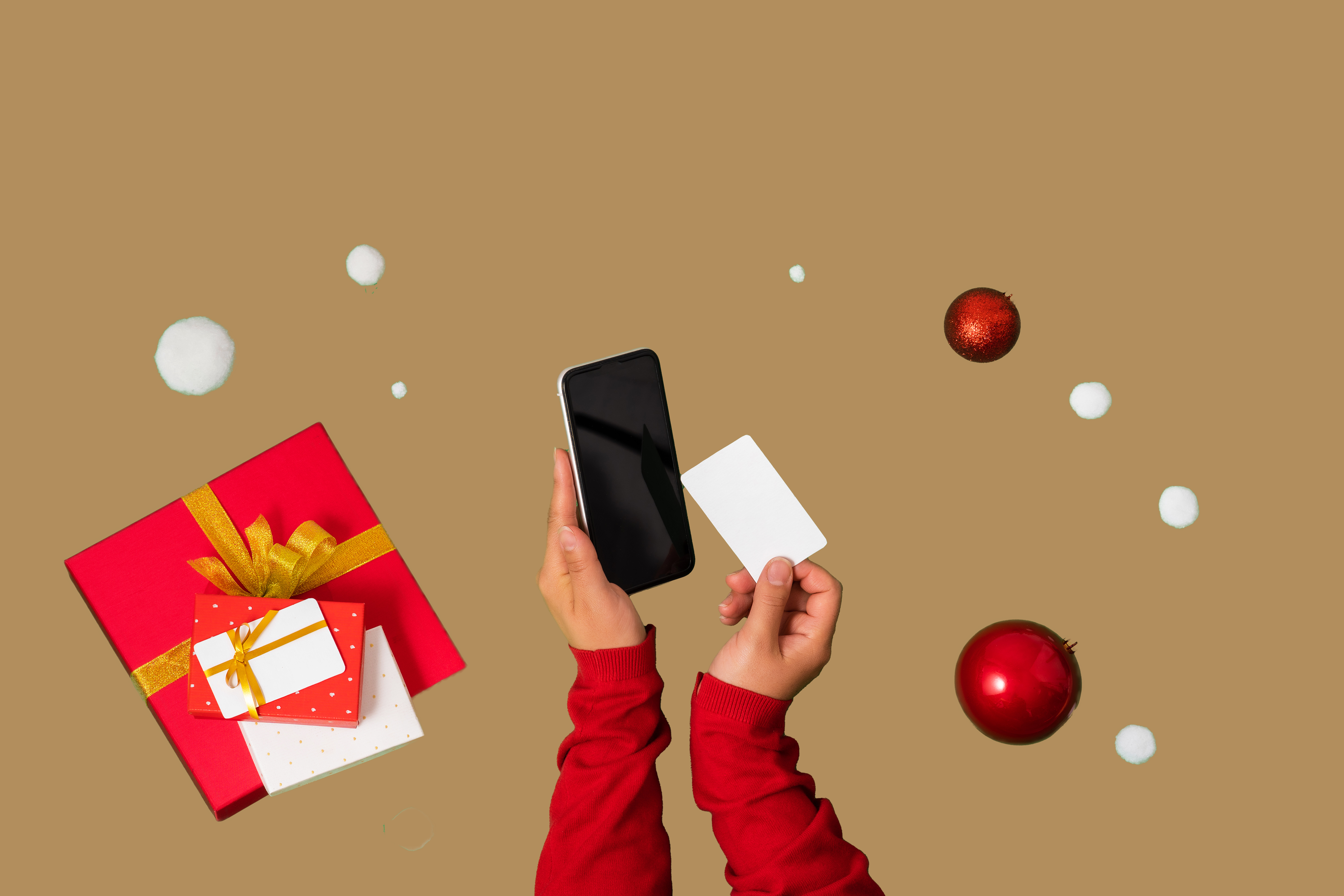 mobile-phone-and-bank-card-in-female-hands-gift-b-2022-10-27-20-47-48-utc